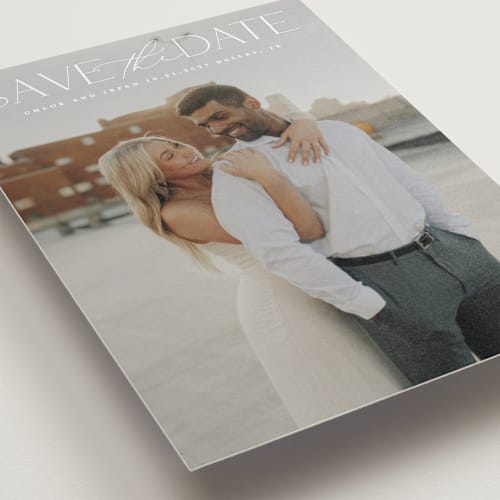 This is a ivory petite save the dates with standard by Maja Cunningham called prose printing on recycled smooth signature in petite