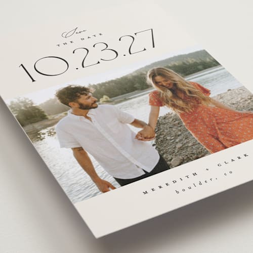 This is a ivory petite save the dates with standard by Carolyn Nicks called romancing the date printing on recycled smooth signature in petite
