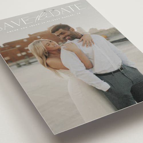 This is a ivory save the date postcards with standard by Maja Cunningham called prose printing on signature in postcard