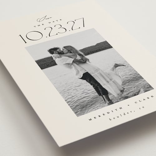This is a ivory save the date postcards with standard by Carolyn Nicks called romancing the date printing on signature in postcard