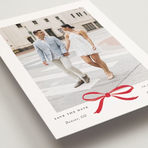 This is a crimson save the date postcards with standard by Olivia Kanaley Inman called crimson bow printing on signature in postcard