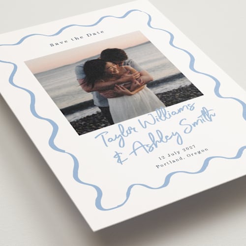 This is a dusty blue save the date postcards with standard by Cass Loh called handdrawn wavy frame printing on signature in postcard