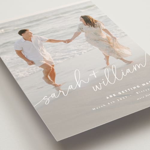 This is a ivory save the date postcards with standard by Jessie Steury called sweet script printing on signature in postcard