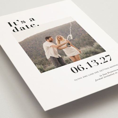 This is a onyx save the date postcards with standard by Joyce Pinheiro called it's a date! printing on signature in postcard