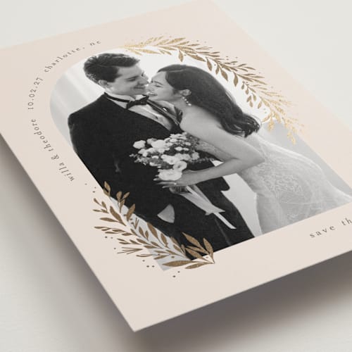 This is a linen save the date postcards with foil pressed by Laura Hankins called garland arch printing on signature in postcard