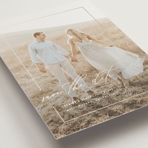 This is a linen save the date postcards with foil pressed by Kelly Schmidt called gilded frame printing on signature in postcard
