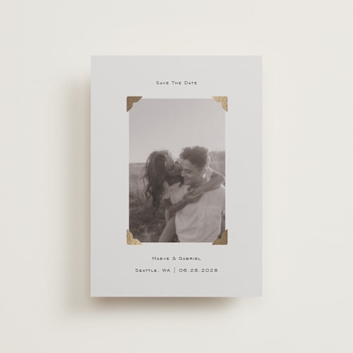 This is a cream petite save the dates with foil pressed by Jenny Millington called scrapbook frame printing on recycled smooth signature in petite