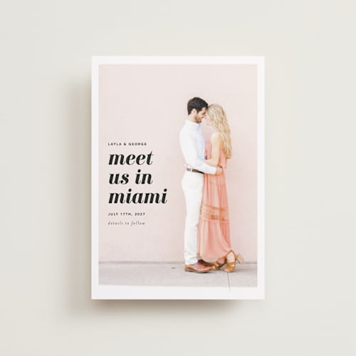 This is a blush petite save the dates with standard by Laura Hamm called meet us in miami printing on recycled smooth signature in petite