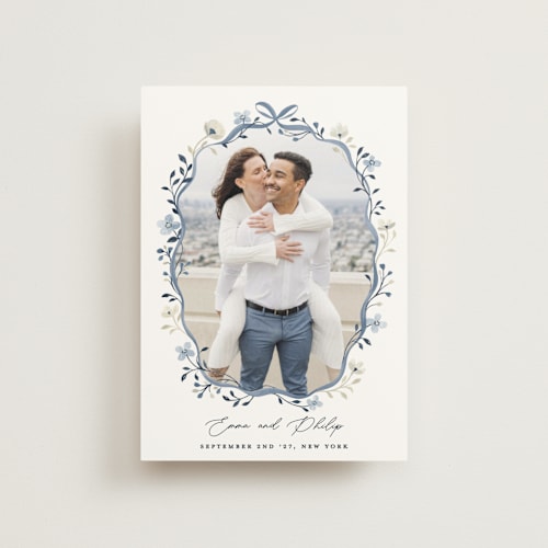 This is a french blue save the date postcards with standard by Sarah Knight called parisian ribbon printing on signature in postcard