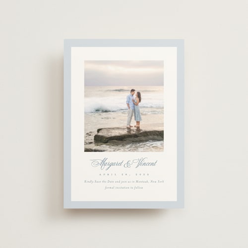 This is a dusty blue save the date postcards with standard by Jennifer Postorino called coastal charm printing on signature in postcard