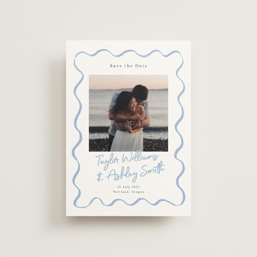 This is a dusty blue save the date postcards with standard by Cass Loh called handdrawn wavy frame printing on signature in postcard