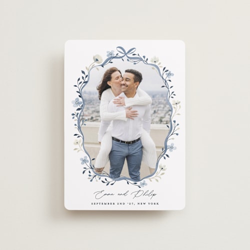 This is a french blue petite save the dates with standard by Sarah Knight called parisian ribbon printing on recycled smooth signature in petite