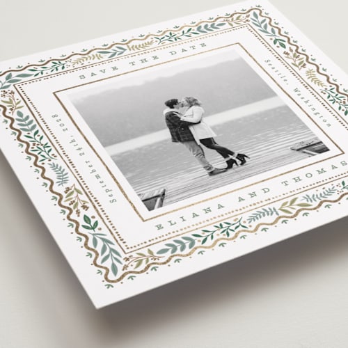 This is a snow foil stamped save the date cards with foil pressed by Alethea and Ruth called square leafy border printing on recycled smooth signature in standard