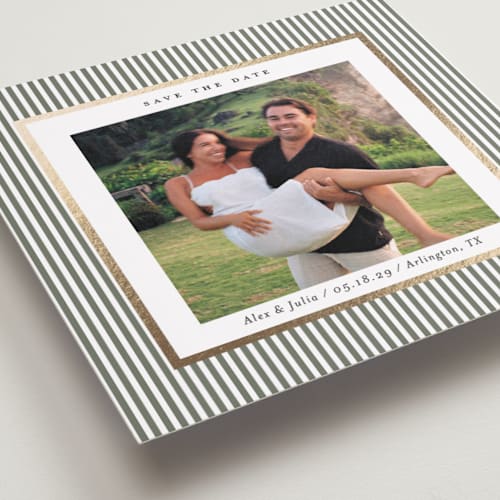 This is a sage green foil stamped save the date cards with foil pressed by Lucrecia Caporale called striped frame printing on recycled smooth signature in standard