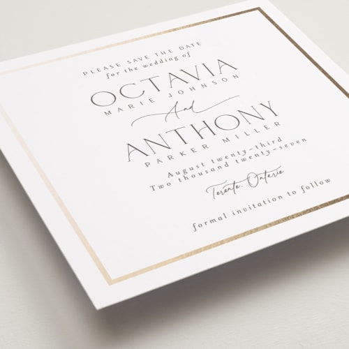 This is a porcelain foil stamped save the date cards with foil pressed by Nicole Walsh called regal printing on signature in standard
