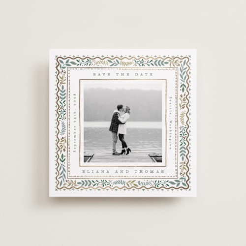 This is a snow foil stamped save the date cards with foil pressed by Alethea and Ruth called square leafy border printing on recycled smooth signature in standard