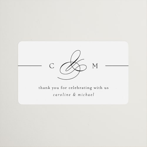 This is a silk wedding favor labels with standard by Kelly Schmidt called framed monogram printing on uncoated sticker paper in sticker