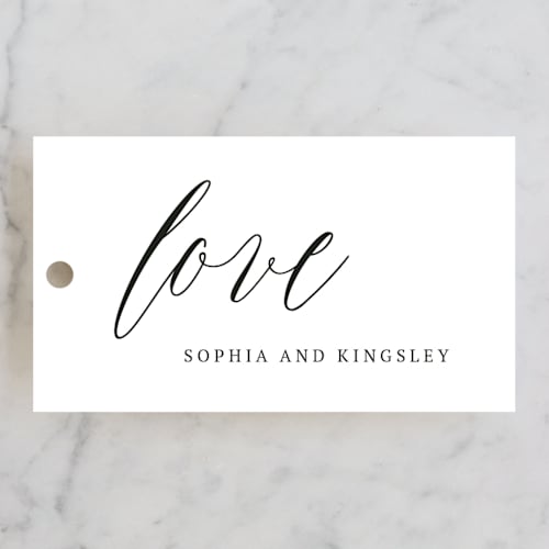 This is a cream wedding favor tags with standard by Design Lotus called nothing compares to you printing on signature in tag