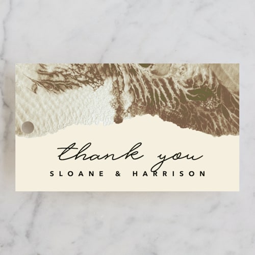 This is a sand wedding favor tags with standard by Carrie Moradi called organic elegance printing on signature in tag