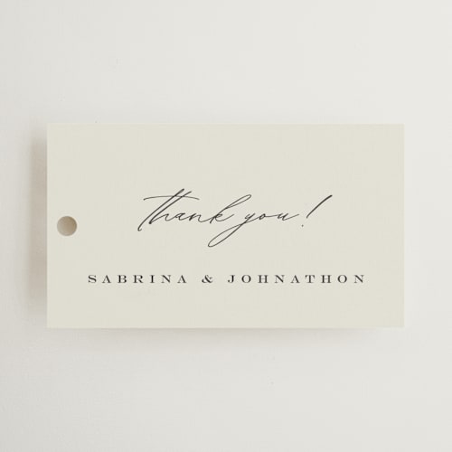 This is a ivory wedding favor tags with standard by Carolyn Nicks called softly swept printing on signature in tag