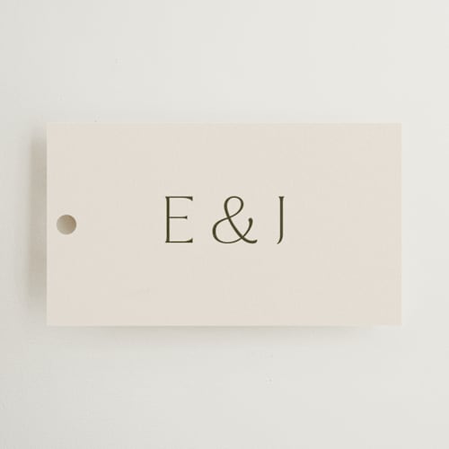 This is a almond wedding favor tags with standard by Olivia Kanaley Inman called blockprint printing on signature in tag