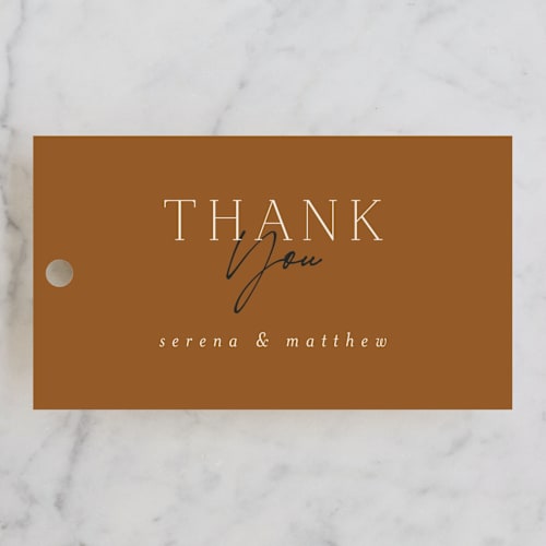 This is a butterscotch wedding favor tags with standard by Morgan Kendall called modern traditionalist printing on signature in tag
