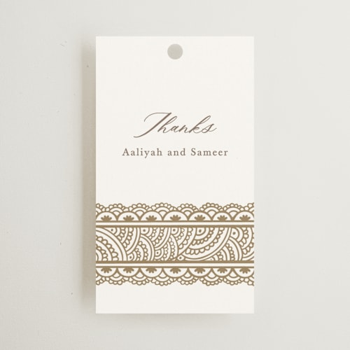 This is a lily wedding favor tags with standard by Mansi Verma called gilded henna printing on signature in tag