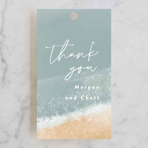 This is a seaglass wedding favor tags with standard by Rebecca Durflinger called seaside printing on signature in tag
