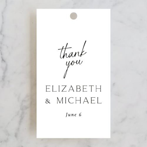 This is a pearl wedding favor tags with standard by Jackie Mangiolino called symphony printing on signature in tag