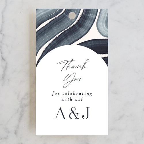 This is a navy wedding favor tags with standard by Alethea and Ruth called painted trails printing on signature in tag