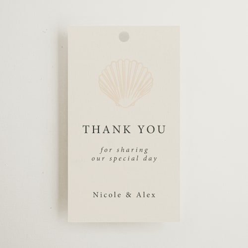 This is a sand wedding favor tags with standard by Hannah Bowman called simple seashell printing on signature in tag