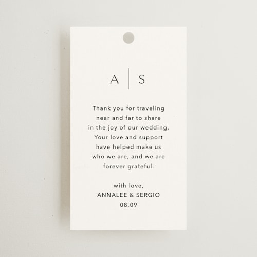 This is a simply white wedding favor tags with standard by Jennifer Postorino called rhythmic printing on signature in tag