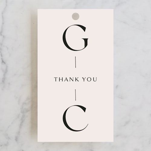 This is a cream wedding favor tags with standard by Sandra Picco Design called genevieve printing on signature in tag
