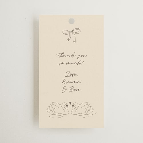 This is a buttercream wedding favor tags with standard by Helena Vitto called the swan printing on signature in tag