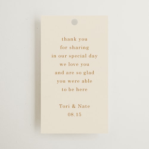 This is a cream wedding favor tags with standard by Baumbirdy called floral type arch printing on signature in tag