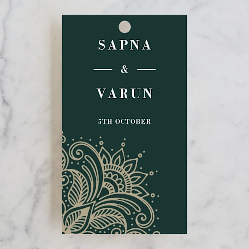 This is a cardamom wedding favor tags with standard by Oma N. Ramkhelawan called engraved paisley printing on signature in tag