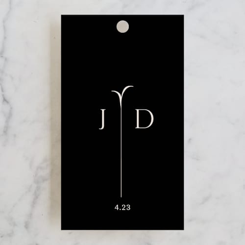 This is a cream wedding favor tags with standard by Annie Lowe called convergence printing on signature in tag