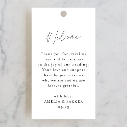 This is a obsidian wedding favor tags with standard by Jennifer Postorino called handwritten printing on signature in tag