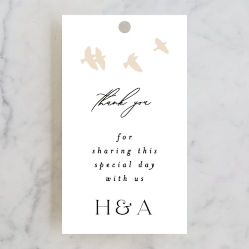 This is a cream wedding favor tags with standard by Phrosné Barwood called soar printing on signature in tag
