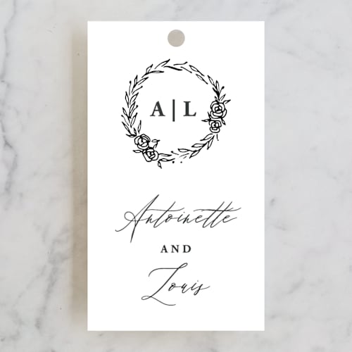 This is a ivory wedding favor tags with standard by lulu and isabelle called antoinette printing on signature in tag