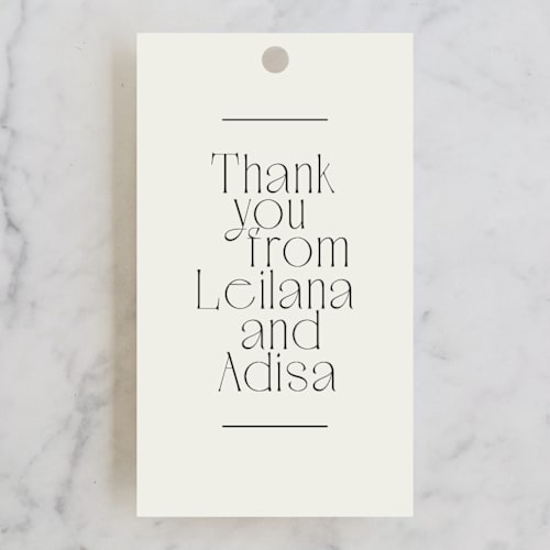 This is a ivory wedding favor tags with standard by Jennifer Wick called cadence printing on signature in tag