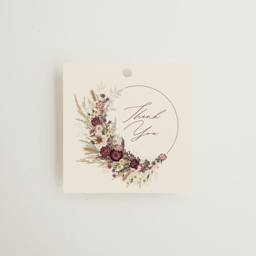 This is a cabernet wedding favor tags with standard by Erin Deegan called dried floral wreath printing on signature in tag