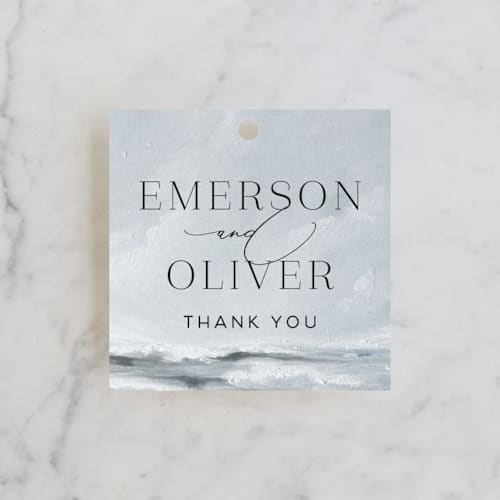 This is a cloud wedding favor tags with standard by Nicoletta Savod called water's edge printing on signature in tag