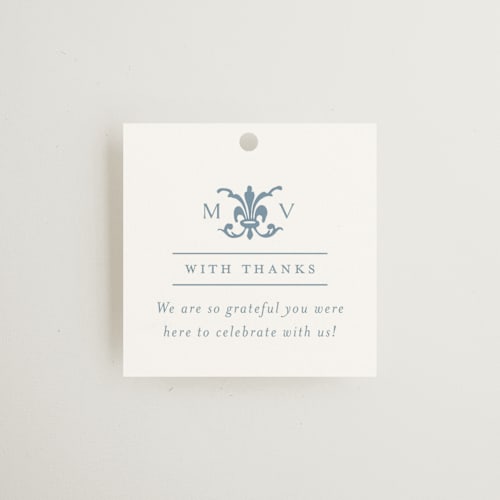 This is a dusty blue wedding favor tags with standard by Jennifer Postorino called coastal charm printing on signature in tag