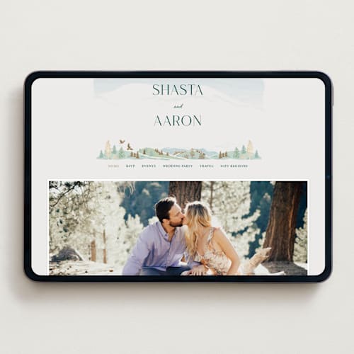 This is a evergreen wedding websites by Paper Sun Studio called mountaintop printing on digital paper in standard