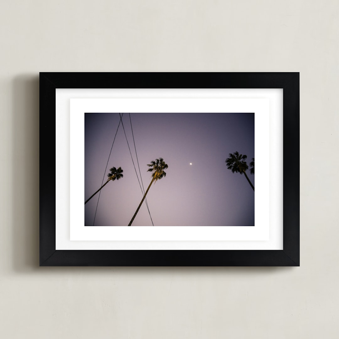 "Pink Palms" - Art Print in Sunset Violet by Kitty Seeber - Framed
