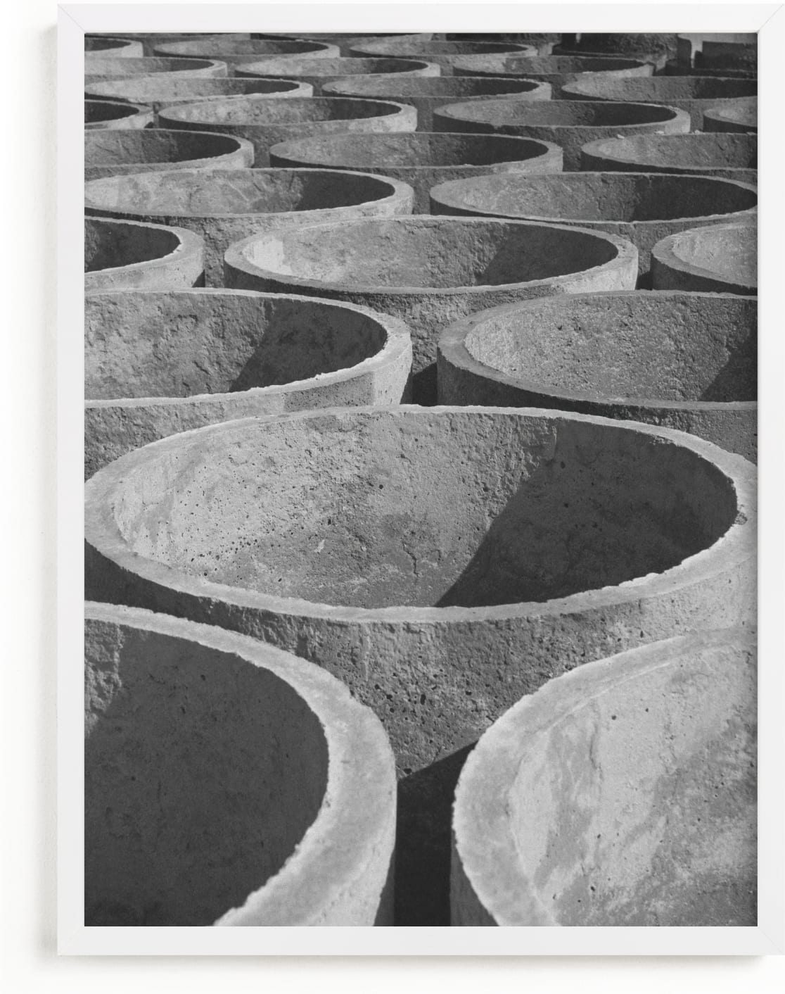 This is a black and white art by Alaric Yanos called concrete cylinders.