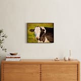 "Portrait of a cow II" - Art Print in Calm Orange by Lying on the grass - In a Room