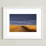 "Dirt Road Through a Wheat Field Under a Stormy Sky" - Art Print in Indigo Sky by Kathy Van Torne - Framed