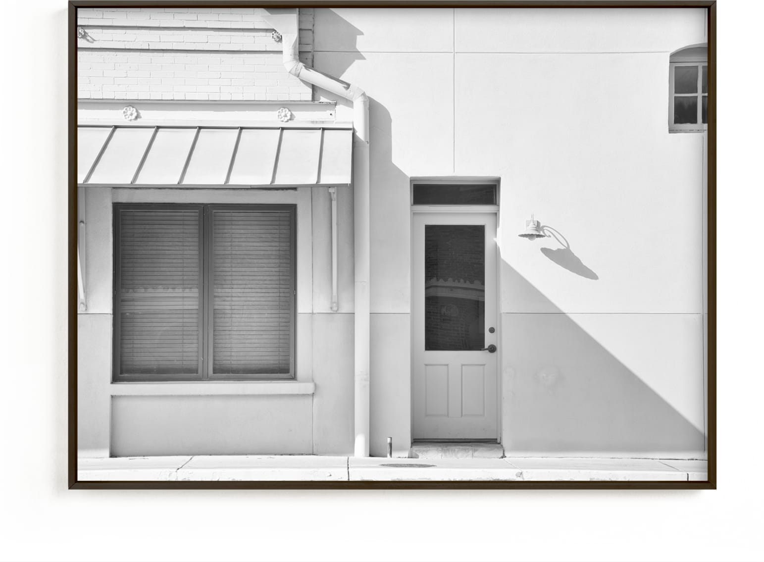 This is a black and white art by Carol Schiraldi called Cream Colored Building, Taylor, Texas.